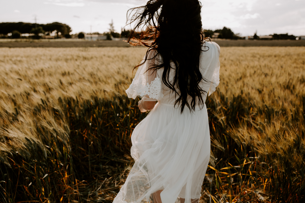 Model running in the wheat fields - Vermeil Gold and Silver Jewelry - Piper and Pearl - Dainty handmade jewelry made in Montreal - Freshwater pearls